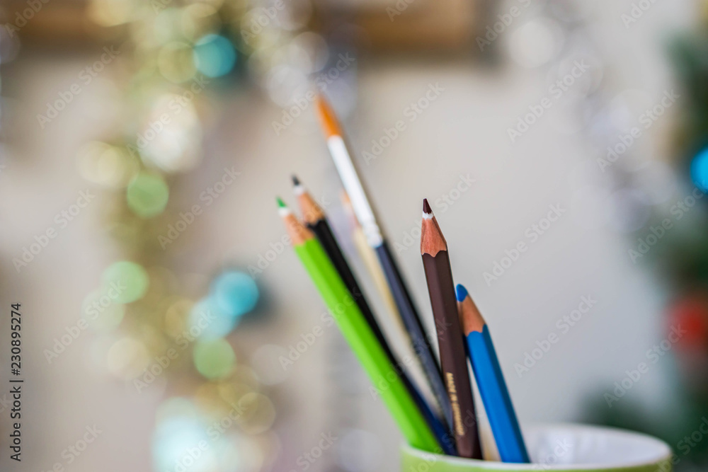 Concept creativity, watercolor pencils and a brush in a cup. Color palette, watercolor technique. Shallow depth of focus, bareback background, copy space. Concept creativity, watercolor pencils and a brush in a cup. Color palette, watercolor technique. Shallow depth of focus, bareback background, copy space.