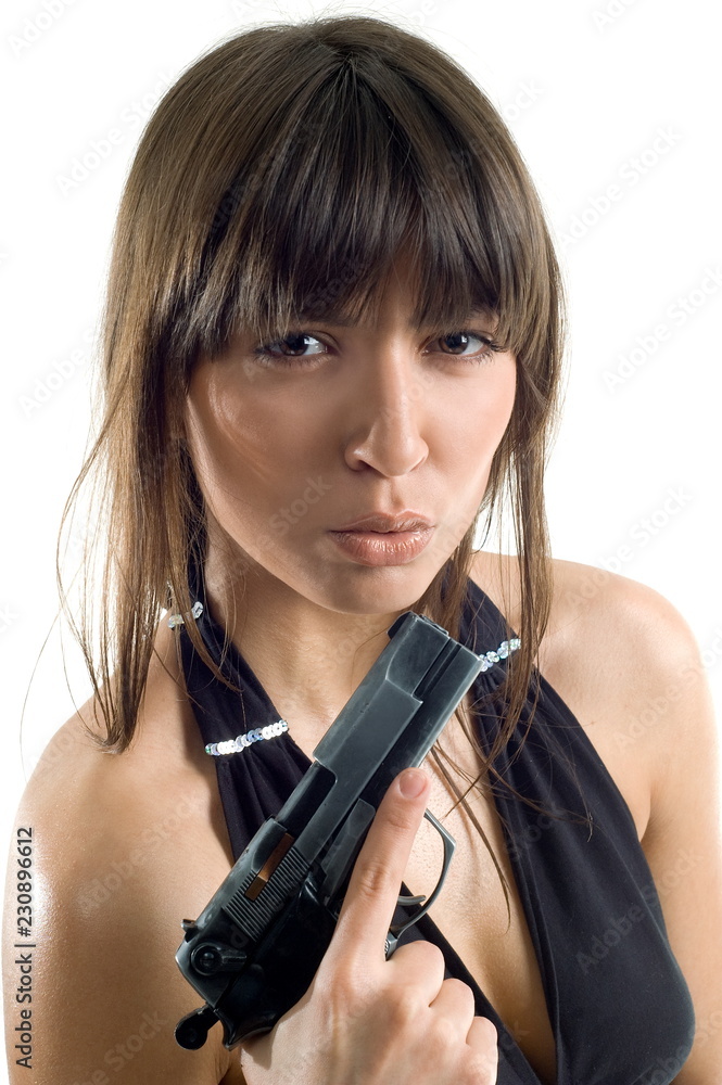Beautiful girl with gun on white background is insulated Beautiful girl with gun on white background is insulated