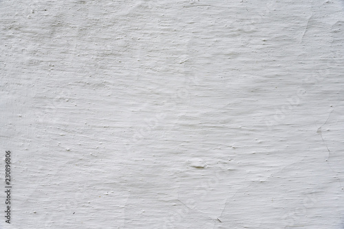 Adobe whitewashed wall, retro background with detailed texture, white color