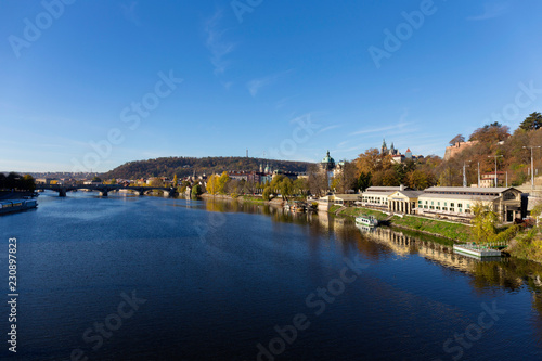 Colorful autumn Prague gothic Castle with the Lesser Town above River Vltava in the sunny Day  Czech Republic