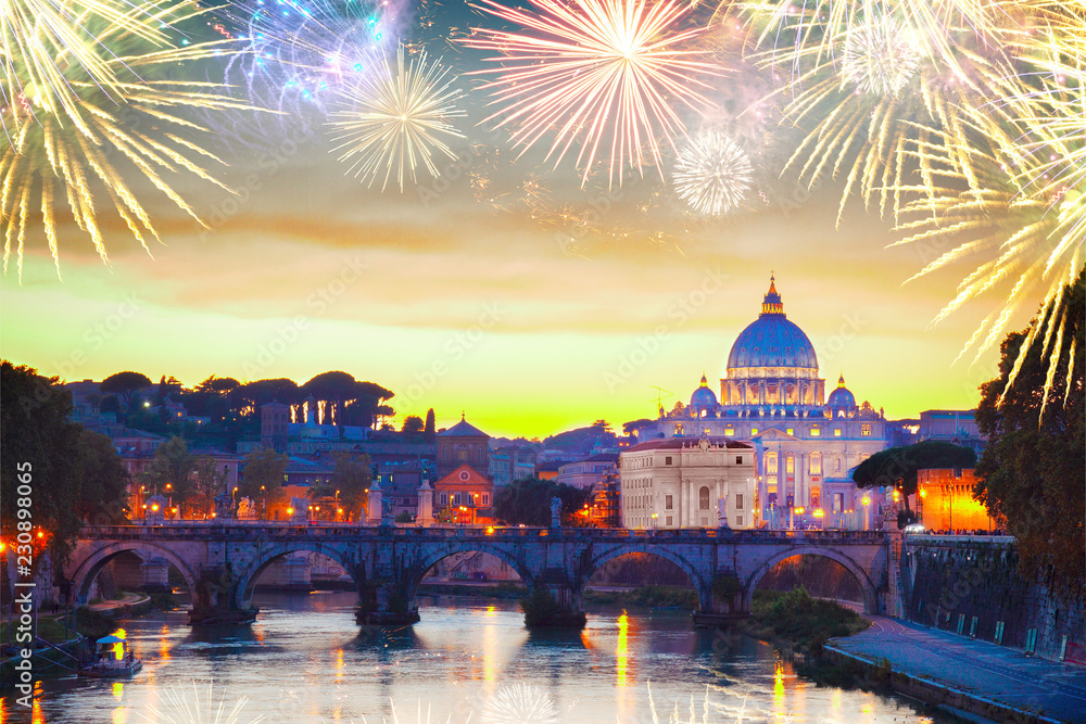 illuminated St. Peter's cathedral over bridge and river in Rome at sunset with fireworks, Italy