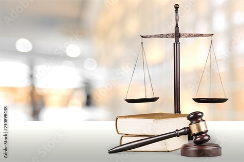 Justice Scales and books and wooden gavel