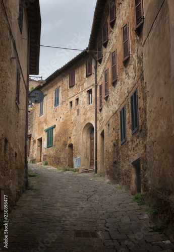 View of narrow street in Italian town, Tuscany, Italy.