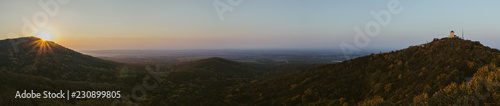 View on a valley at sunrise. Autumn panorama.