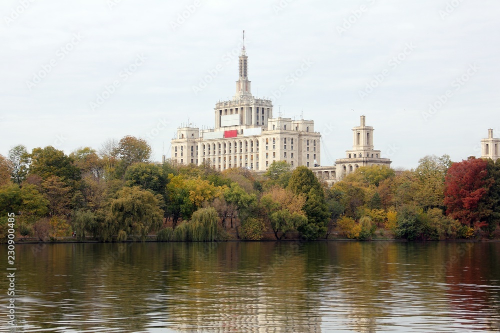 Beautiful autumn day in Herastrau Park, with House of Free Press (Casa Presei Libere) in the background Beautiful autumn day in Herastrau Park, with House of Free Press (Casa Presei Libere) in the background