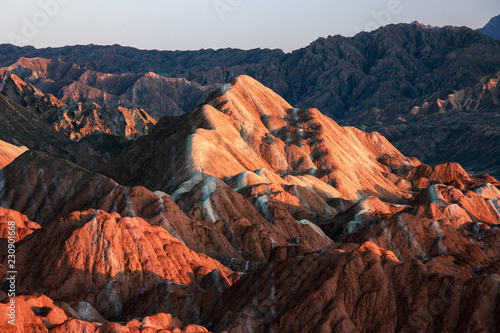 Zhangye Danxia National Geopark - Gansu Province, China. Chinese Danxia multicolor danxia landform, rainbow hills, unusual colored rocks, sandstone erosion, layers of Red, Yellow and Orange stripes.