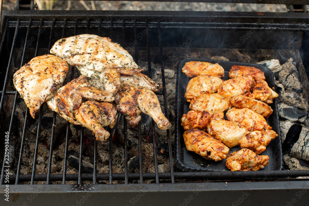 Roasted chicken legs and wings. Beautiful grill.