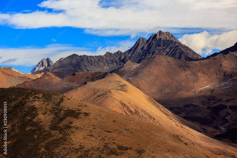 Naklejka premium High altitude martian landscape, highlands around Xinduqiao - Ganzi Tibetan Autonomous Prefecture, Sichuan Province China. Chinese landscape - Yaha Pass near Gongga Mountain, Minya Konka. Jagged Peaks