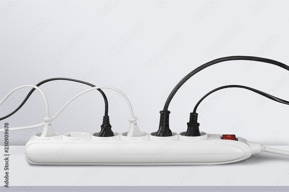 Socket strip and connected plugs on background Socket strip and connected plugs on background