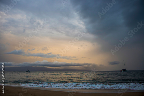 Boats on Ocean under Cloudy Sunset Sky in Seascape as Storm Approaches