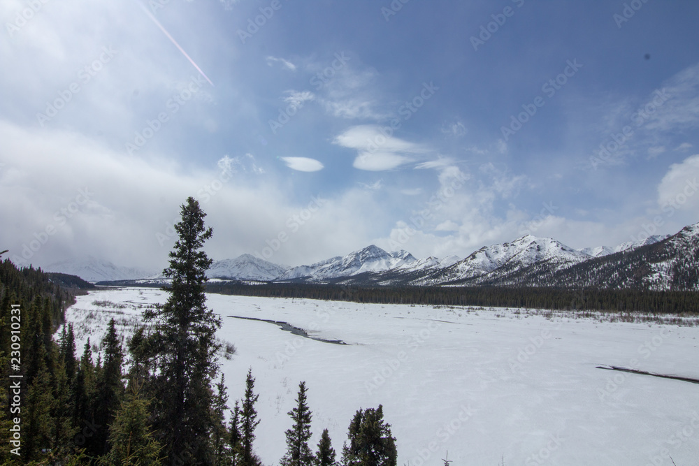Frozen river between the mountains Frozen river between the mountains