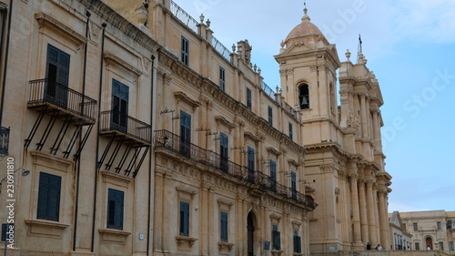 Noto, province of Syracuse, Sicily. View of the building at the left of St Nicholas Cathedral, that it can see in the background. Both buildings are representative of the sicilian baroque.