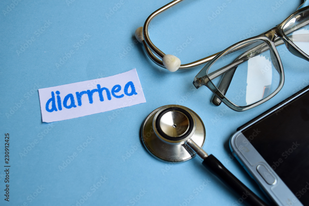 Conceptual image with Diarrhea inscription with the view of stethoscope, eyeglasses and smartphone on the blue background. Medical Conceptual. Conceptual image with Diarrhea inscription with the view of stethoscope, eyeglasses and smartphone on the blue background. Medical Conceptual.