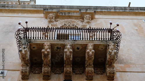 City of Noto. Province of Syracuse, Sicily. One of the spectacular balconies of the Palazzo Nicolaci. The city of Noto is known as one of the most remarcable examples of the sicilian baroque style. photo