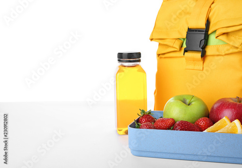 Lunch box with healthy food for schoolchild on white background. Space for text