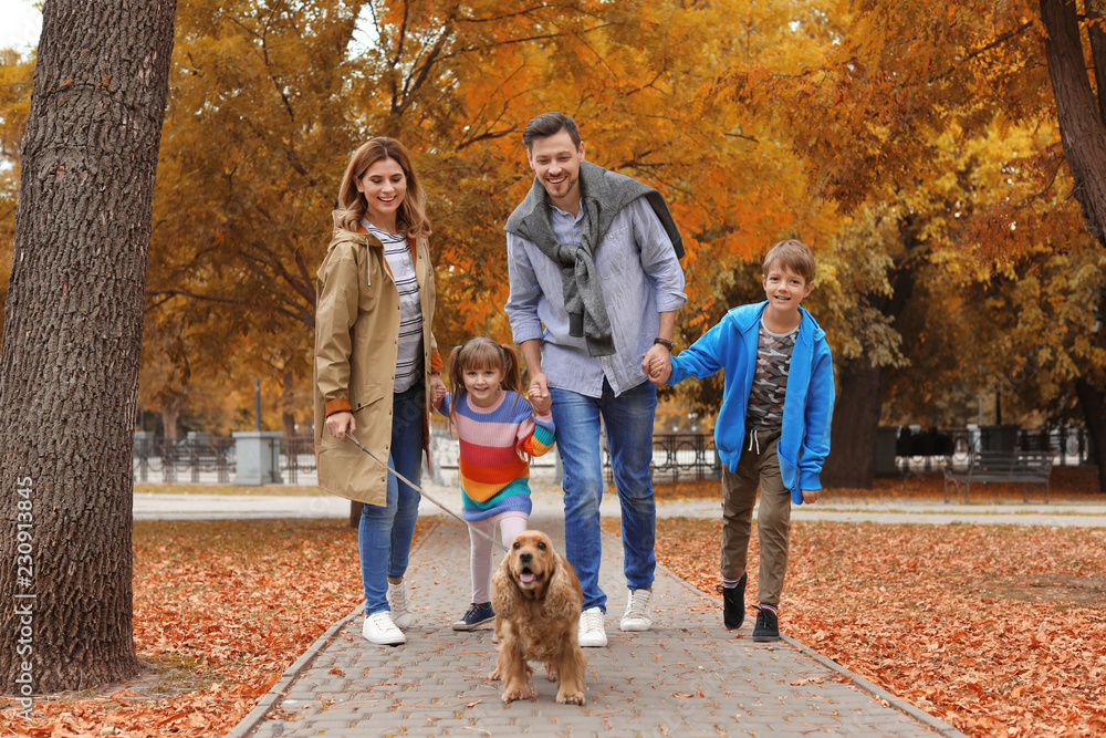 Happy family with children and dog in park. Autumn walk Happy family with children and dog in park. Autumn walk