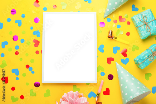 Festive frame or bright background, gift, confetti, carnival hat and streamer. Flat style. Birthday or holiday card with a copy.