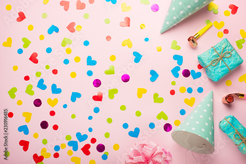 Birthday party background with party hats and streamers
