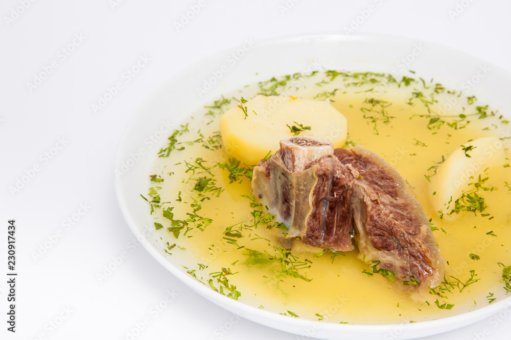 Traditional Colombian beef rib broth isolated on white background Traditional Colombian beef rib broth isolated on white background
