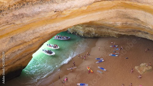 Boats in the famous Benagil sea cave in Portugal