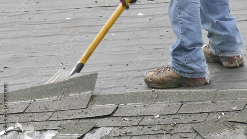 Removing old shingles from a roof 4K
