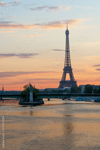 Eiffel tower in Paris, France. Image of Eiffel tower with the reflection in the Seine river in Paris, France. © ake1150