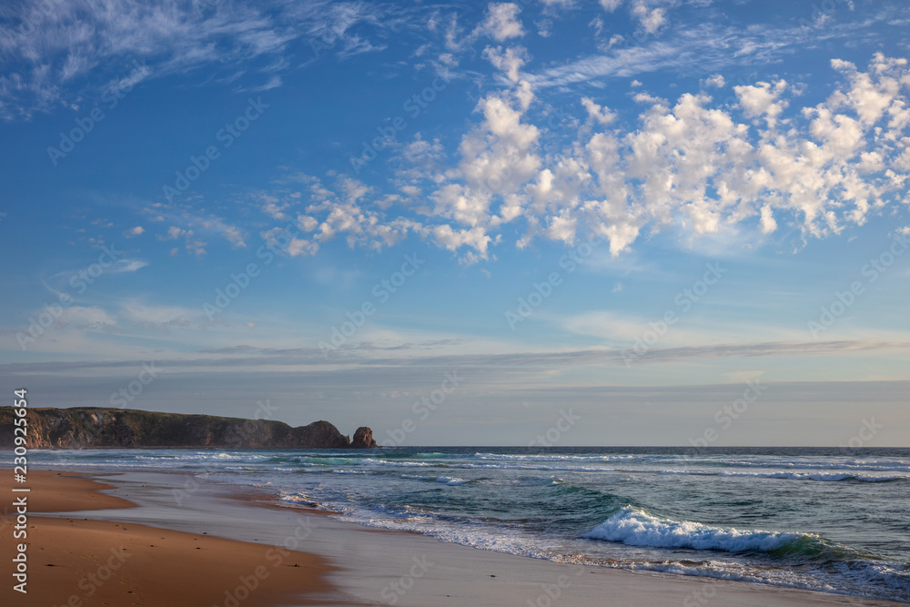 Clouds over Cape Woolamai beach, with the Pinnacles rock formation visible in the background