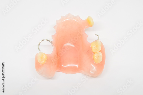 removable denture on white background