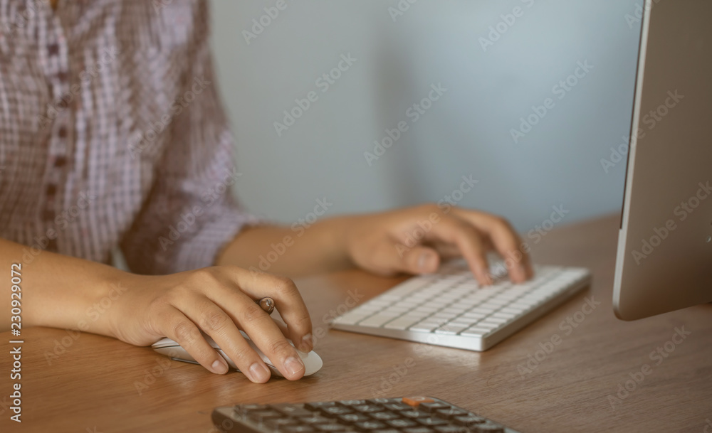 Lady working at home with computer,Her hand holding pen writing a blog and Creative idea of work 2019 goals, writing, drawing, making notes in document Business,investment,concept,Soft focus. Lady working at home with computer,Her hand holding pen writing a blog and Creative idea of work 2019 goals, writing, drawing, making notes in document Business,investment,concept,Soft focus.