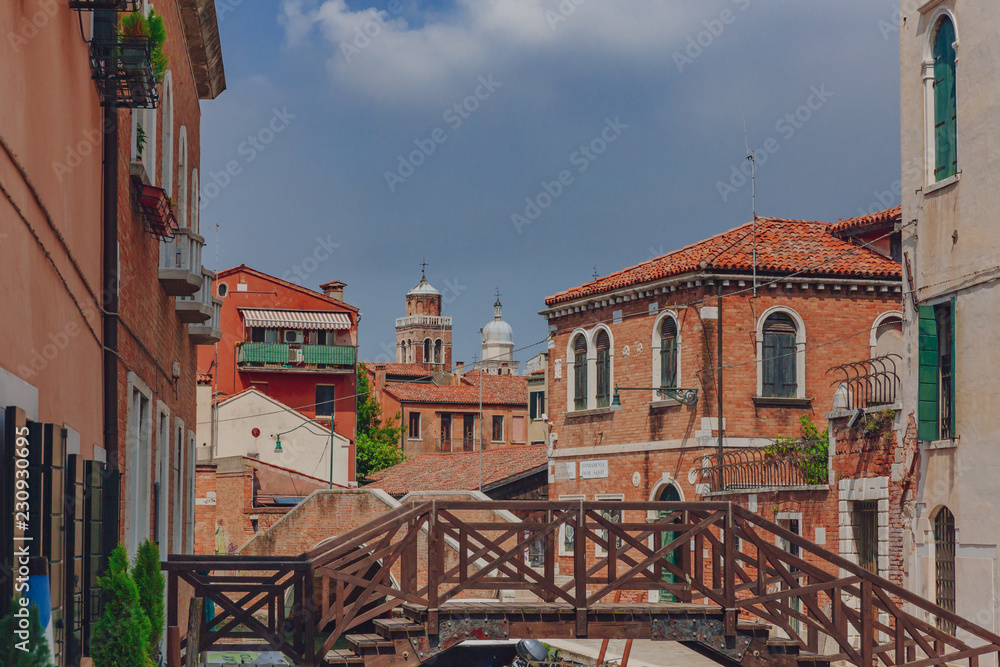 Obraz premium Venetian houses and bridge in Venice, Italy