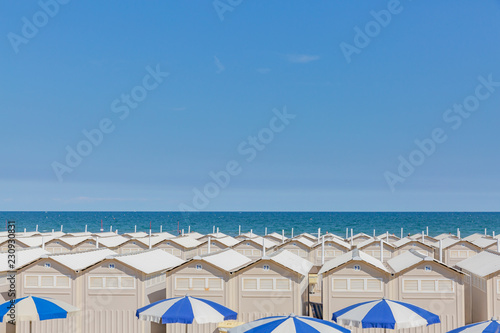 Fototapeta Naklejka Na Ścianę i Meble -  Huts and umbrellas on the beach of Lido in Venice, Italy