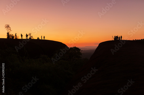 Silhouette people standing on the hill for watching sunrise in morning time this is a good view of Bueng Kan Thailand. Landmark tourism in Thailand. © EmmaStock