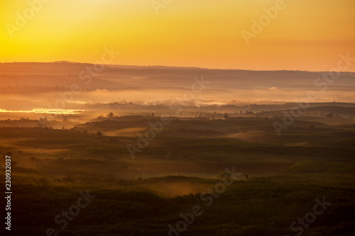 Landscapes aerial view sunrise pattern forest and foggy in morning time Bueng Kan Thailand. © EmmaStock