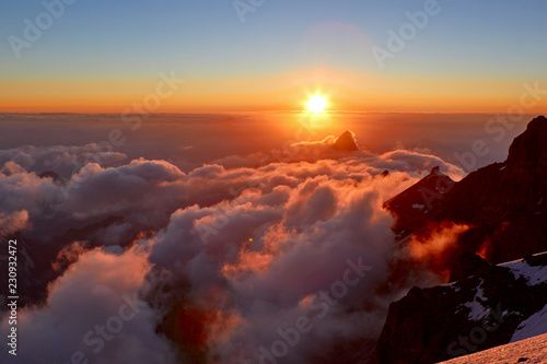 Beautiful sunset on the mountains above clouds, pass Mirali, 5300, Fann, Pamir Alay, Tajikistan © Joe-L