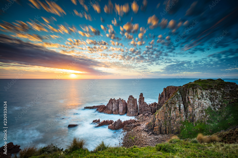 Dramatic long exposure image of the sunset overlooking the Pinnacles a famous rock formation on Phillip Island, Victoria Australia - obrazy, fototapety, plakaty 