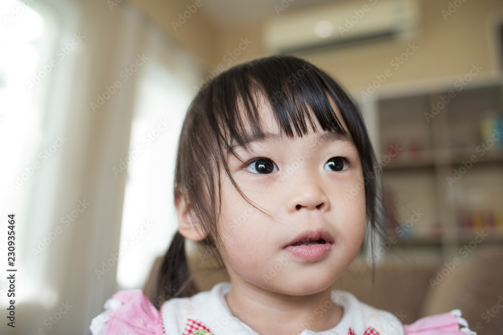 Portrait of Little asian girl playing in her home Portrait of Little asian girl playing in her home