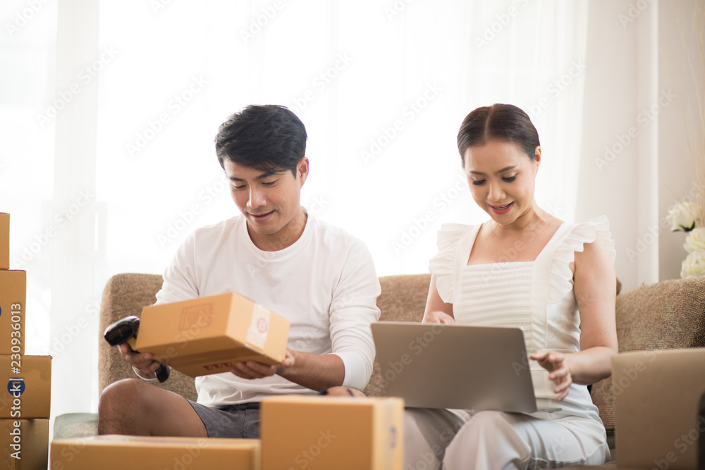 Happy couple at Home office with Online business, Marketing online and freelance job Happy couple at Home office with Online business, Marketing online and freelance job