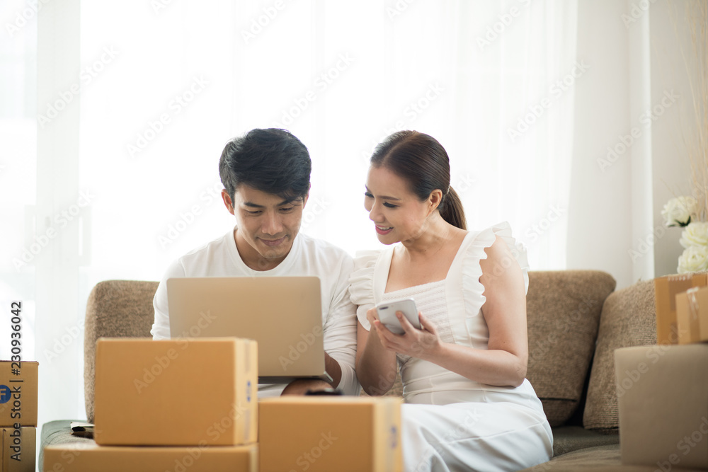 Happy couple at Home office with Online business, Marketing online and freelance job Happy couple at Home office with Online business, Marketing online and freelance job