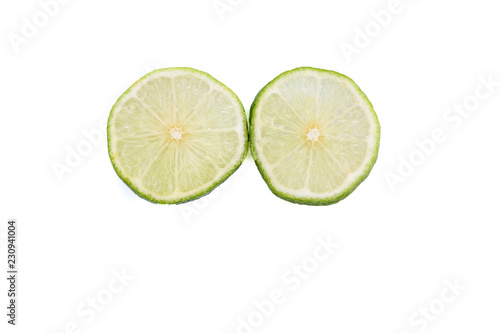 Green Lime with slice cutting isolated on white background