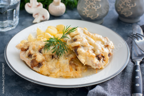 Chicken fillet breast with cheese and mushrooms, selective focus