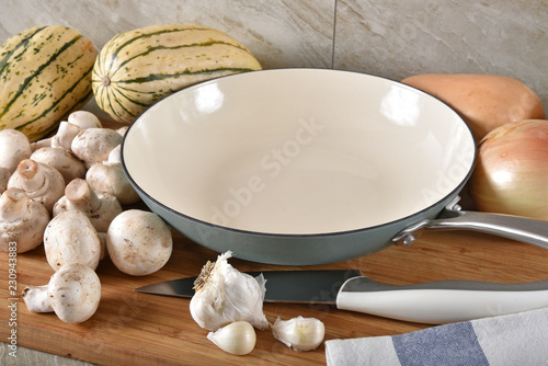 Cast iron skillet on a counter top with fresh ingredients
