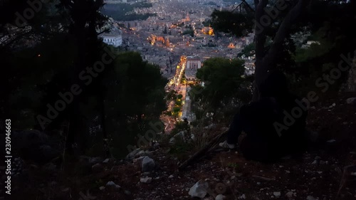 Wallpaper Mural Modica in the Sicily - Italy nightfall timelapse. Man photographs urban hill landscape. Main street seen from the mountain. Torontodigital.ca