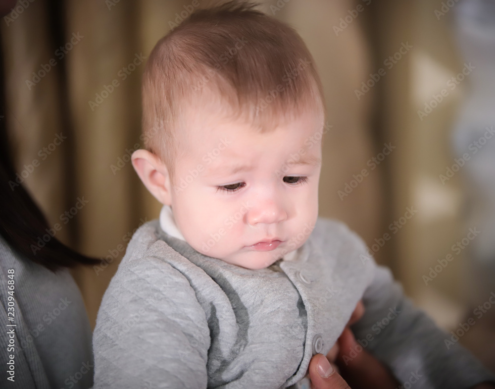 Portrait of sad little baby boy. Textile shop Portrait of sad little baby boy. Textile shop