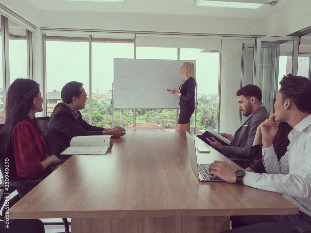 © potsawat - business people in meeting room,Businesswoman explaining new business ideas © potsawat - business people in meeting room,Businesswoman explaining new business ideas