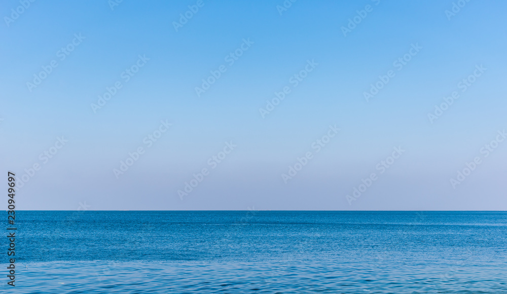 Perfect on blue sky over ocean background.
