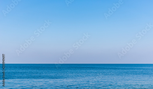 Perfect on blue sky over ocean background.