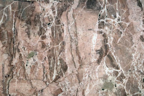 Multicolored layered marble texture with different veins and scratches, may be used as background