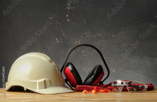 Safety Personal Protective Equipment(PPE) on a rustic black background.