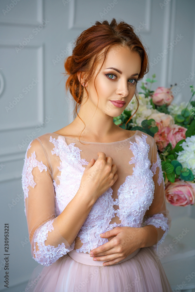 portrait of a young beautiful red-haired woman in a beautiful delicate dress portrait of a young beautiful red-haired woman in a beautiful delicate dress