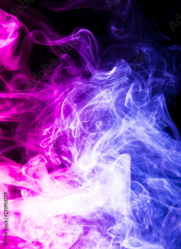 Colored smoke on black background